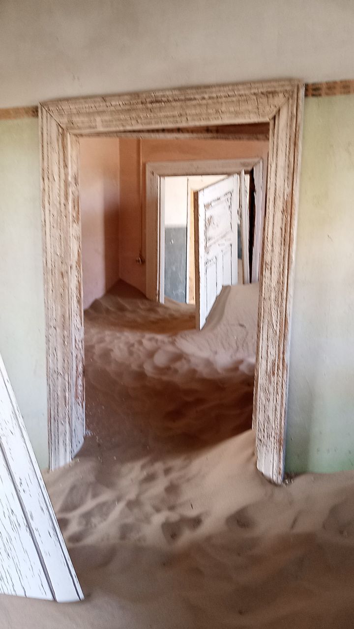 Kolmanskop, Lüderitz, Namibia wild horses, Kolmanskop ghost town, Shark Island Namibia, southern Namibia travel, Namibia self-drive, Sperrgebiet, Aus Namibia, Namibia off the beaten path Sand-filled room in Kolmanskop ghost town Namibia diamond mining abandoned